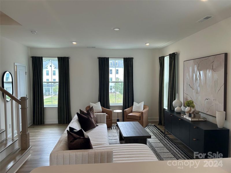 Living room  ( half bath and coat closet behind it)