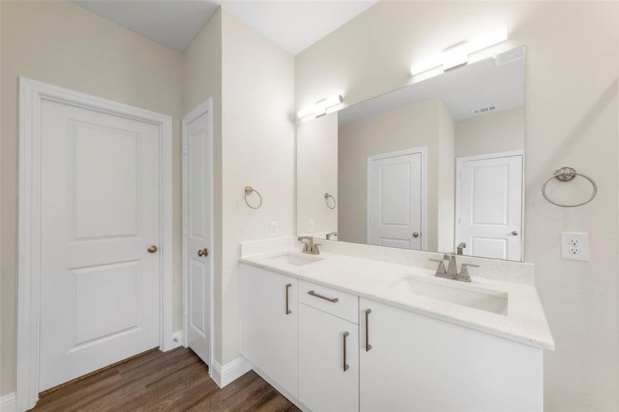 Bathroom featuring vanity and hardwood / wood-style flooring