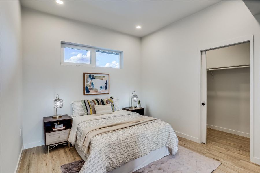 Guest bedroom with walk in closet.