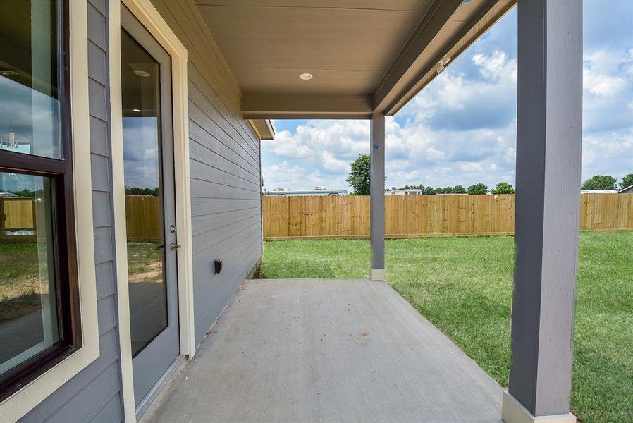 Enjoy your serene and pristine backyard from the comfort of  this fabulous covered patio.