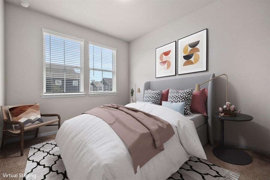 Secondary bedroom features plush carpet, neutral paint, and large windows with privacy blinds.