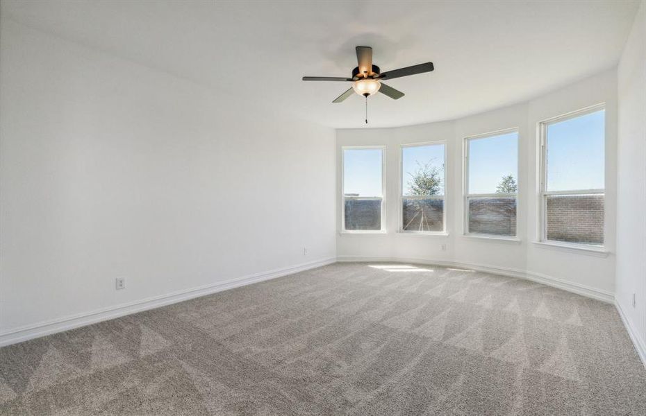 Elegant owner's suite with Bay window *real home pictured