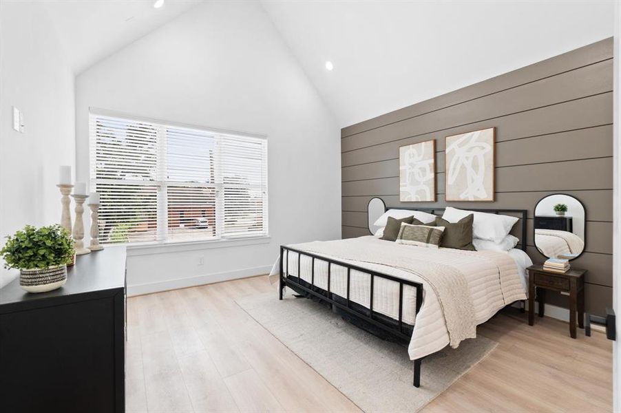 Primary suite with cathedral ceiling, accent wall, great natural light