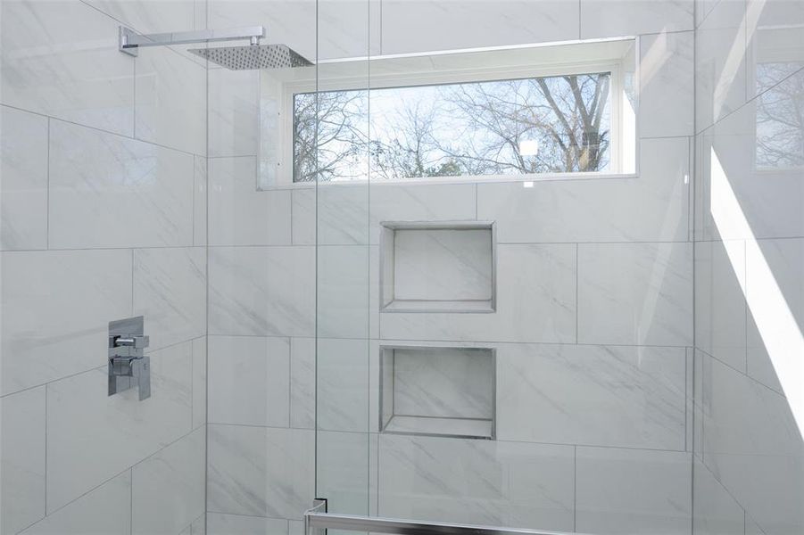 Bathroom with tiled shower