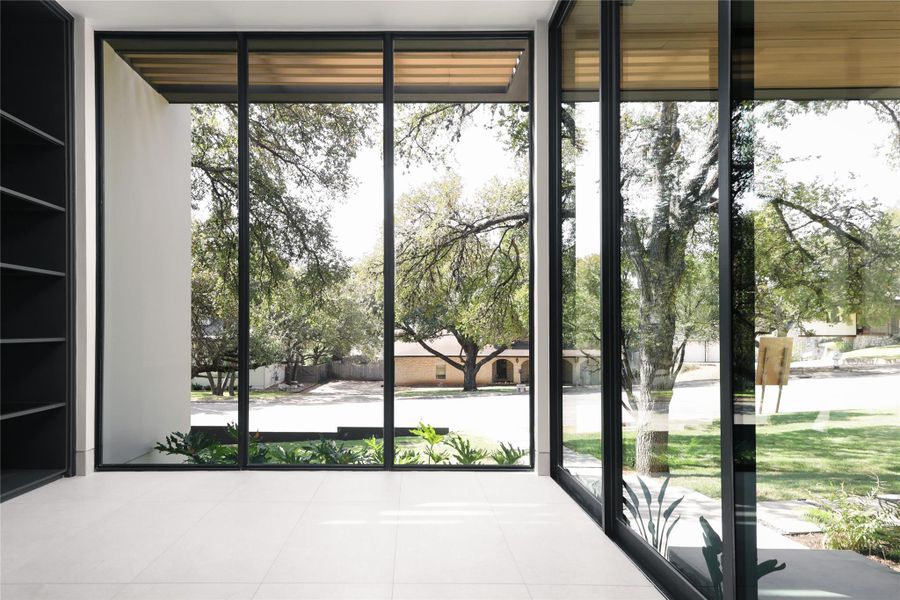 Floor to ceiling windows with exterior entrance to office