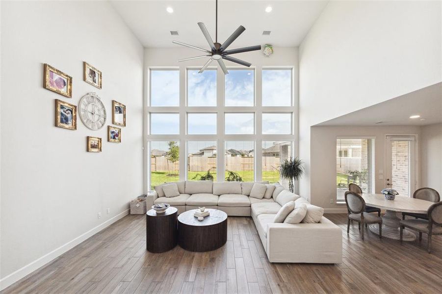 The family room is at the rear of the home and features a wall of windows overlooking the back yard. The family room opens to the breakfast area.