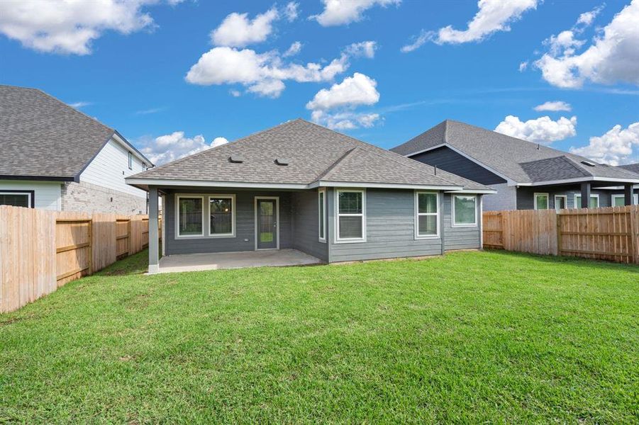 Charming Covered Patio in the Beautiful Backyard offers recessed lighting and a magnificent view of the greenspace with NO back neighbors!