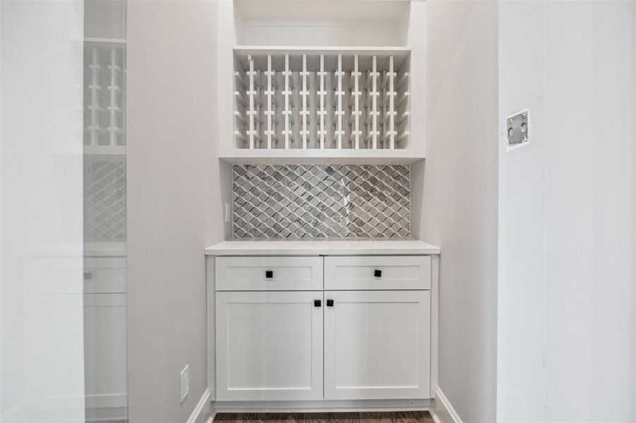 Service pantry with fitted storage adjacent in addition o a fitted walk-in pantry