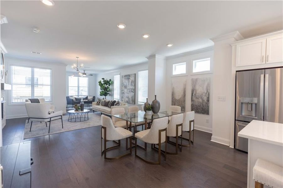 Dining area opens to the family room. **Photos of model house and not of actual home - Photos for representation purposes only **