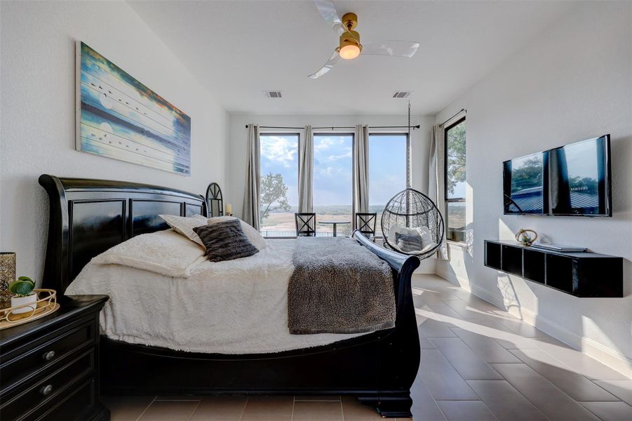 Spacious Bedroom View Suite with Lake Directly Outside can fit a King Bed! Features 3 picture windows, built in cabinetry, barn door, ceiling fan and amazing Lake Views!