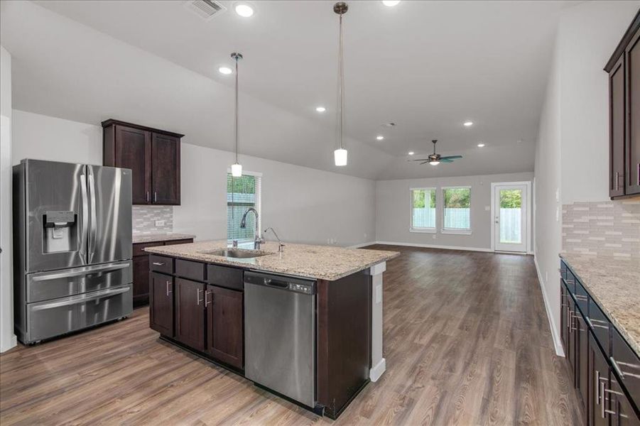 High ceiling and lighting provide an open airy look.