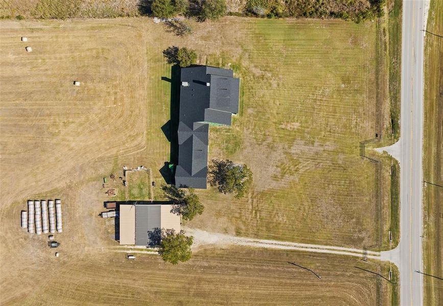 Birds eye view of property featuring a rural view