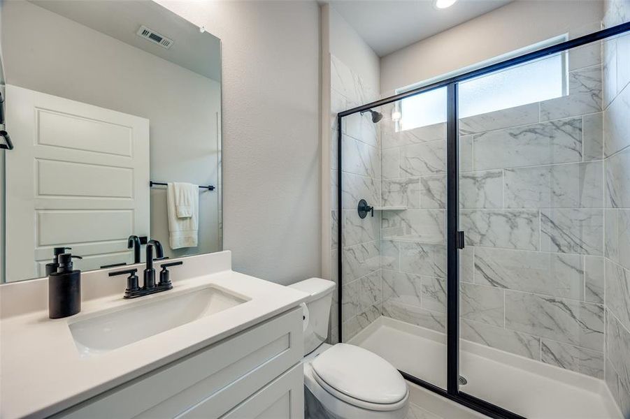 Full Bathroom featuring a walk-in shower with glass door