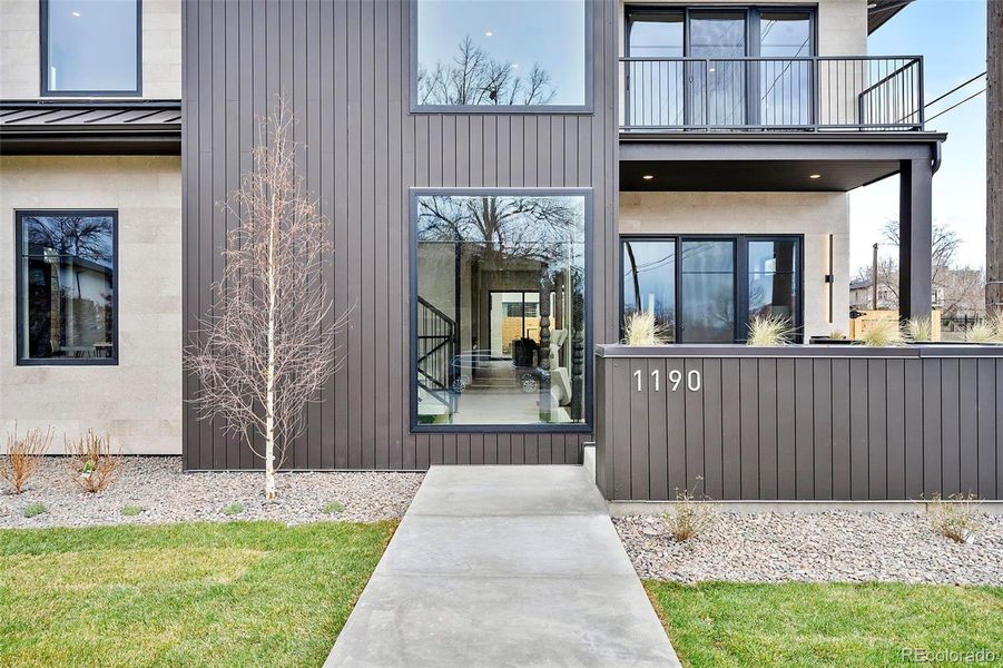 Two-story glass as you approach the home.