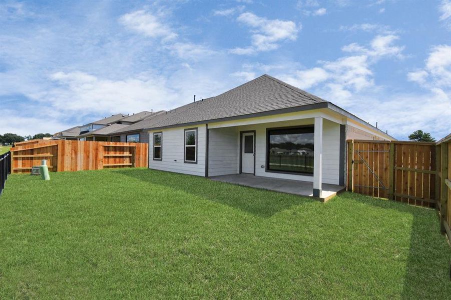 Step into a world of outdoor possibilities with this remarkable backyard and its charming covered patio. From playtime for the kids to relaxation for the adults, this space offers the best of both worlds.