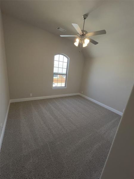 Unfurnished room with ceiling fan and carpet floors