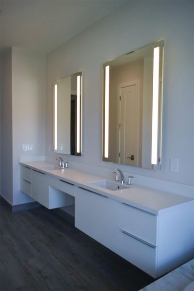 Master Bath Cabinetry with Back lit mirrors from previously built Deerwood