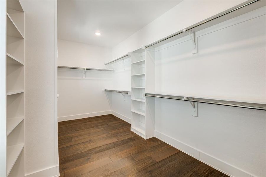 Spacious closet featuring hardwood floors.