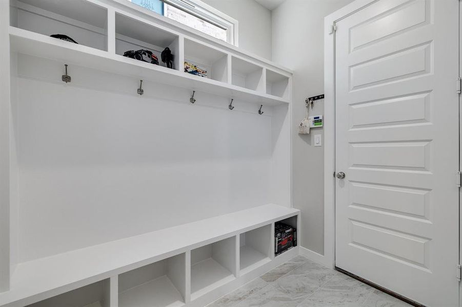 Mudroom featuring light tile patterned floors