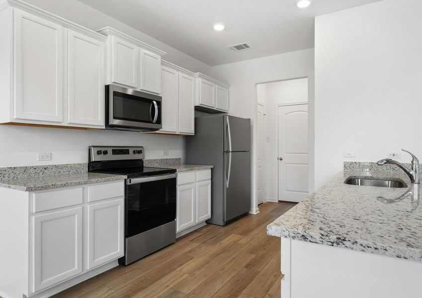 Enjoy granite countertops and stainless steel appliances