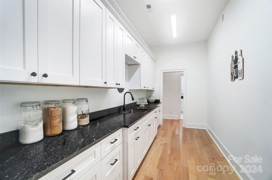 Large butler's pantry with plenty of room for storage. There's room for a second refrigerator