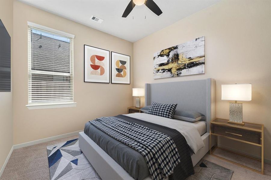 Secondary bedroom features plush carpet, neutral paint, dark stained ceiling fan with lighting and a large window with privacy blinds.