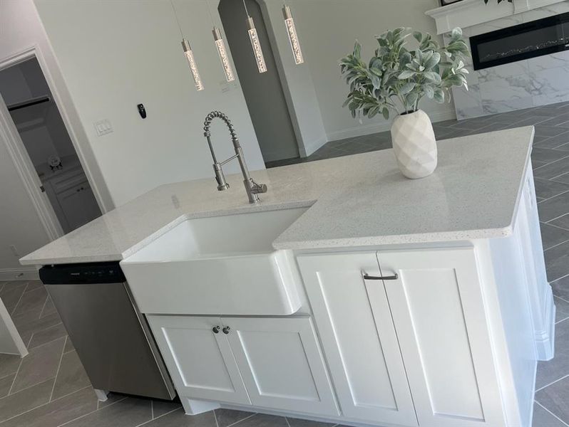 Bathroom featuring tile patterned flooring and sink