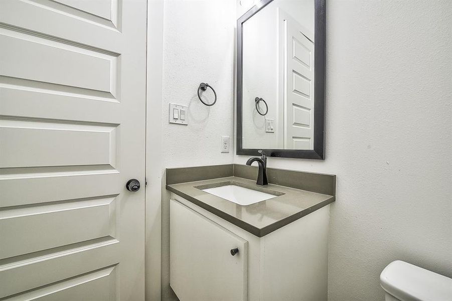 Bathroom with vanity and toilet