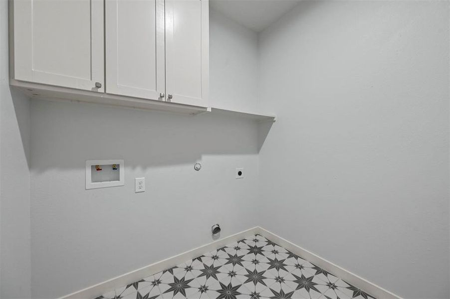 Washroom with cabinets, hookup for an electric dryer, washer hookup and  dryer hookup