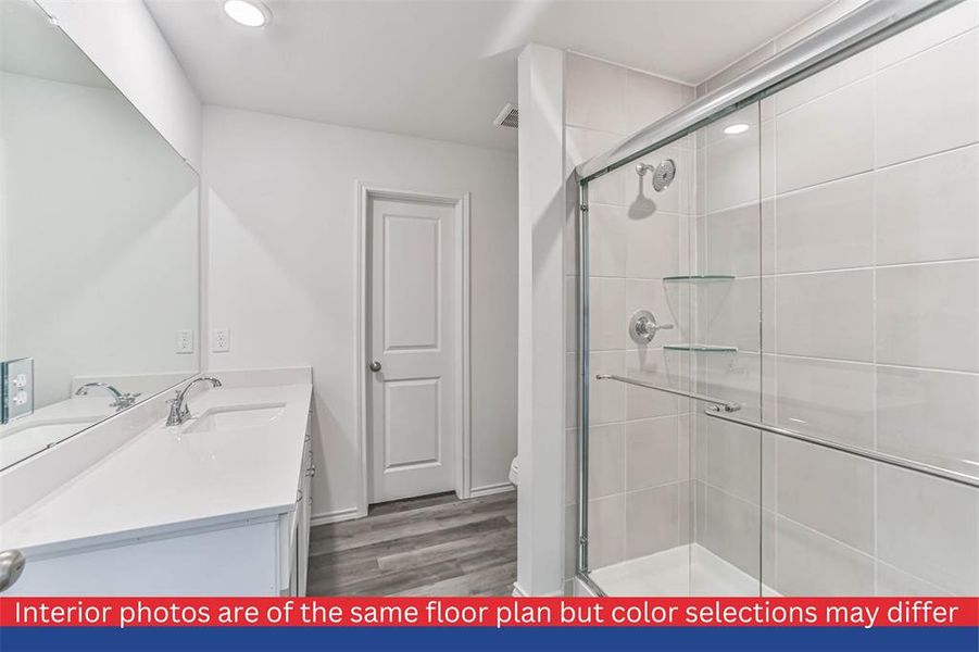 The second bathroom is tastefully designed and easily accessible from the main living areas and bedrooms. It features a modern vanity, a bathtub/shower combination, and stylish fixtures.
