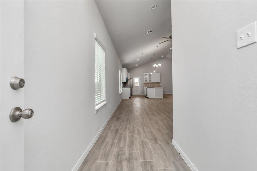 Step inside and be greeted by an expansive open floor plan that flows seamlessly from the entryway to the heart of the home. High ceilings and modern finishes create a sense of space and light, while the tiled floors offer both style and durability. This entryway invites you to explore a home designed for comfortable living and effortless entertaining. **This image is from another Saratoga Home - Wren floorplan.**