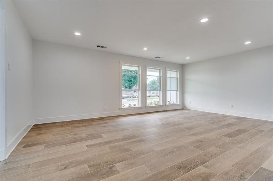 Large living area with almost floor to ceiling windows and recessed lights and this gorgeous brand new floor means you have the nicest home possible at this price point.