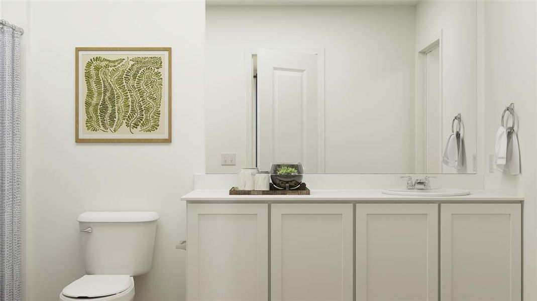 Bathroom with toilet and double sink vanity