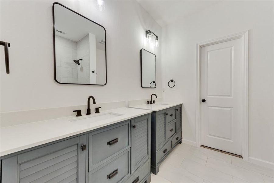 Bathroom featuring vanity and walk in shower