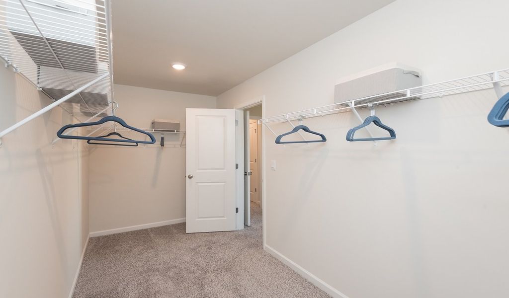 No sweat about space in the walk-in primary closet.
