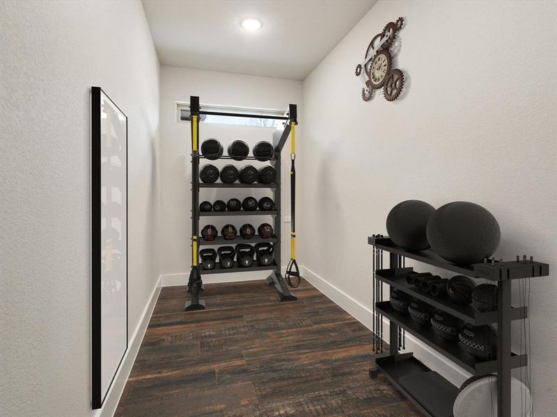 Workout room with dark hardwood / wood-style flooring