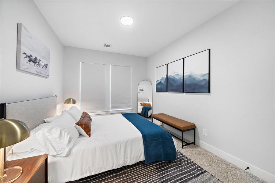 Third bedroom incorporates stylish elements and vibrant accents, making it a charming and lively space.