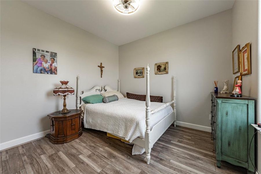 A charming secondary bedroom with generous closet space and large windows