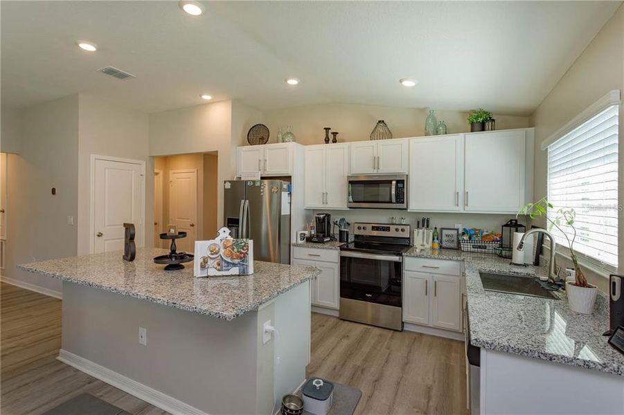 large kitchen with stainless steel appliance package