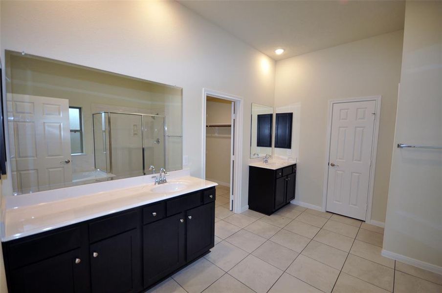 Dual Vanities in the master bath.