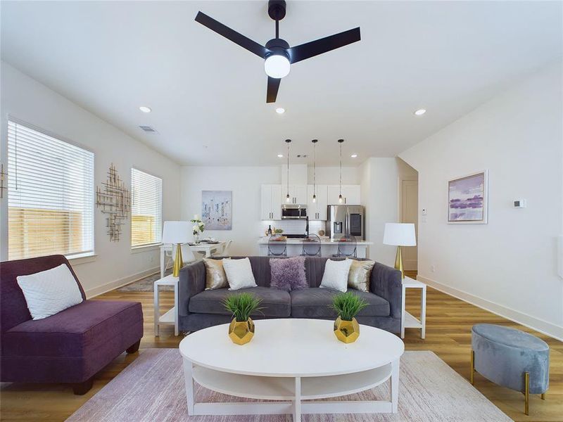 Another partial view of the living room, plus the dining room and kitchen in the background