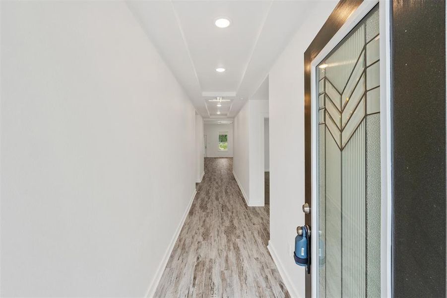 Walk into the elongated foyer that opens up family room.
