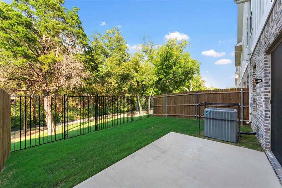 View of yard featuring central AC and a patio