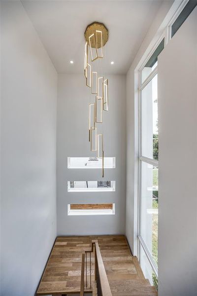 Stairway featuring hardwood / wood-style floors