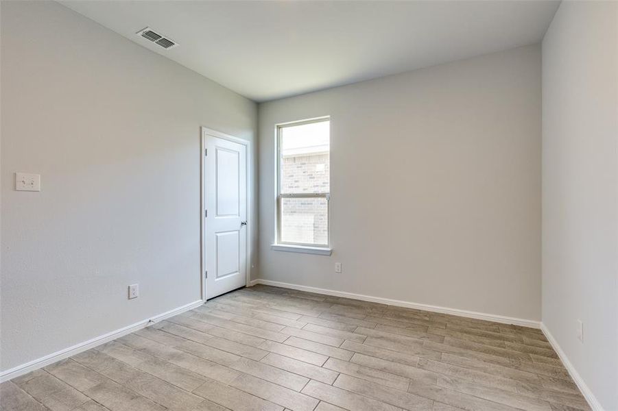 Unfurnished room featuring light hardwood / wood-style floors