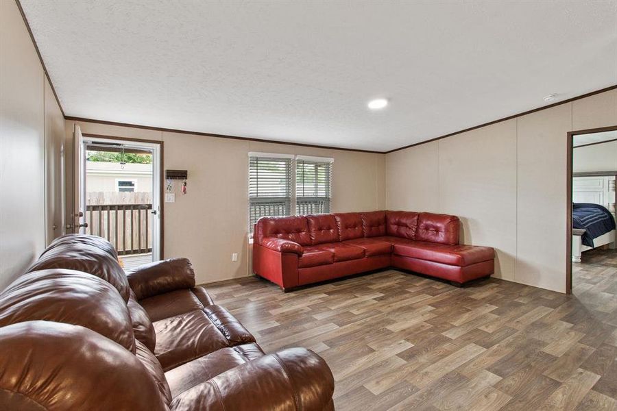 Step into the heart of this home, where the Living room exudes warmth and comfort.