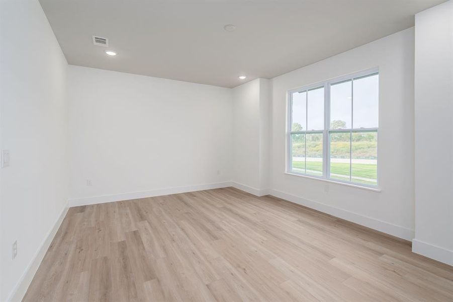 Spare room featuring light hardwood / wood-style floors