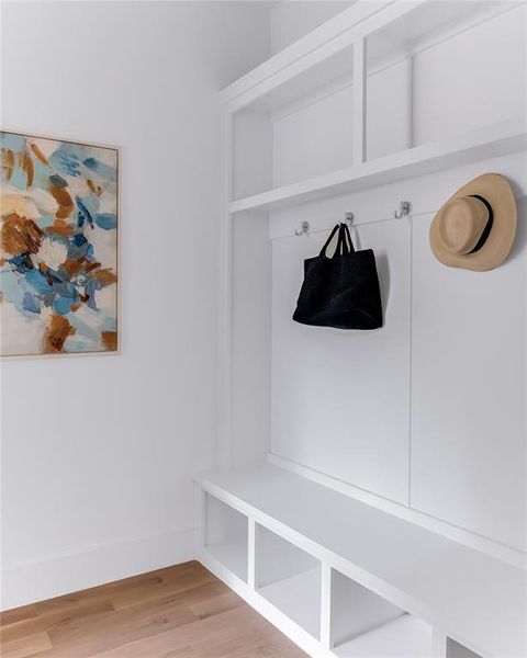 Mudroom with wood-type flooring