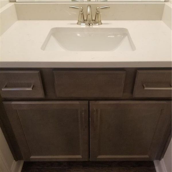 Half Bath on Main Floor with Quartz top and Full Cabinet!