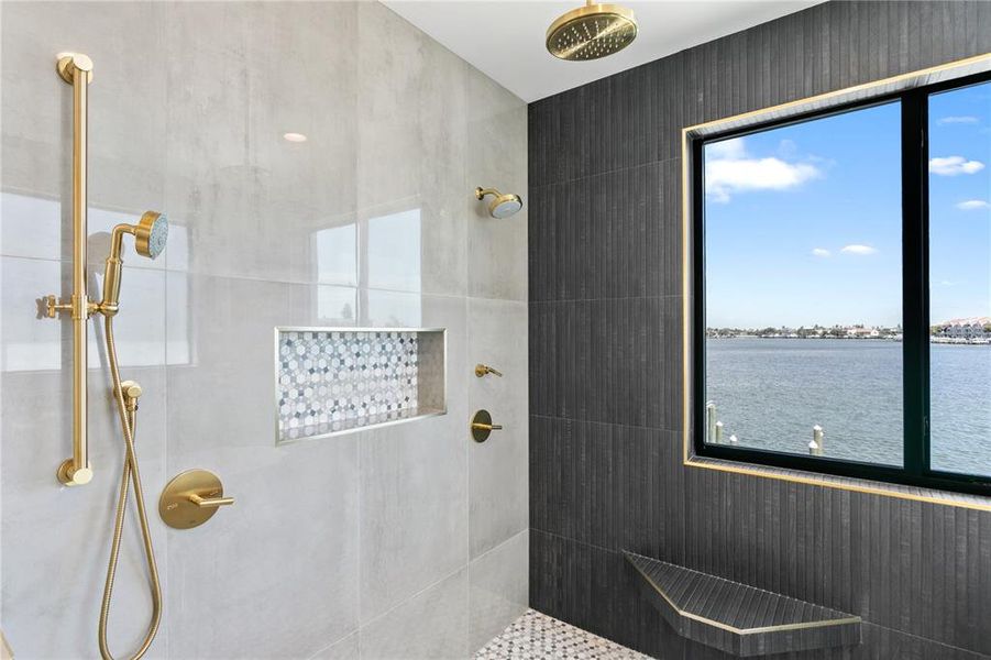 Primary en suite shower with double shower heads and gorgeous water views